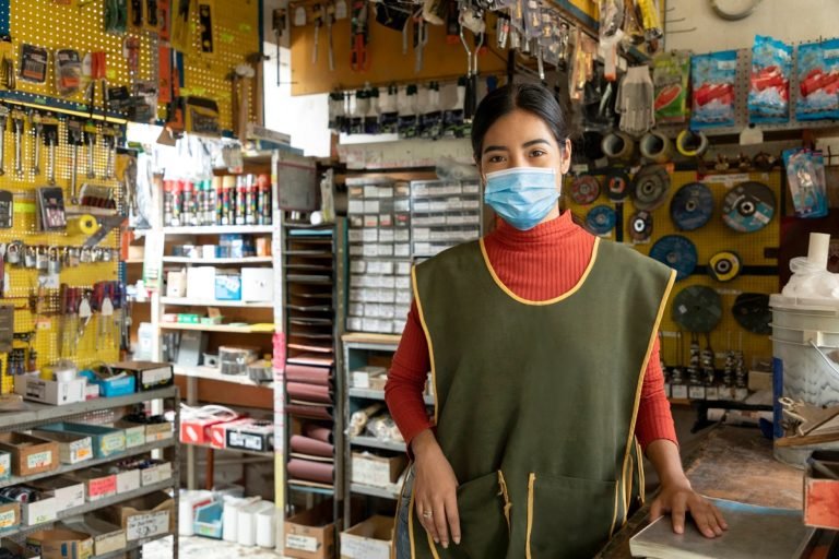 Entrepreneur,Woman,In,His,Business,Working,With,Face,Masks,During