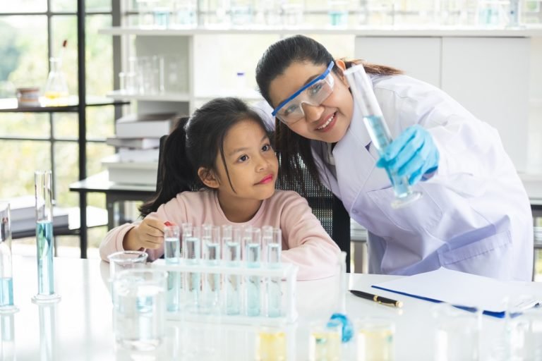 Little,Asian,Children,Girl,In,Elementary,Science,Class,Doing,Chemical