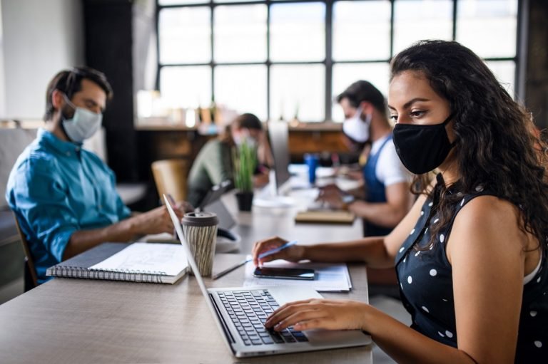Business,People,With,Face,Masks,Indoors,In,Office,,Back,To