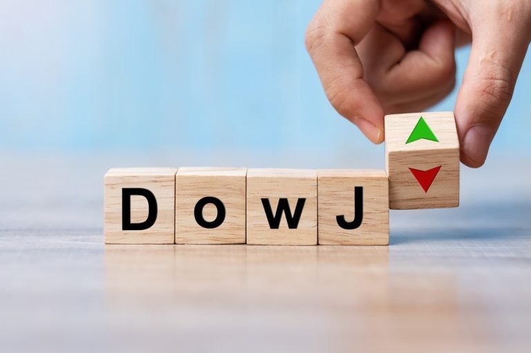 Business,Man,Hand,Change,Wood,Cube,Block,With,Dow,J