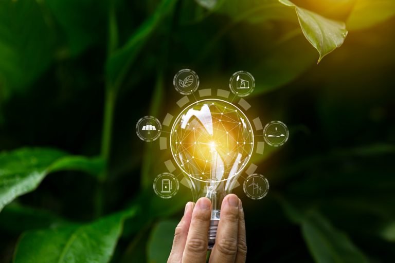 Hand,Holding,Light,Bulb,Against,Nature,,Icons,Energy,Sources,For