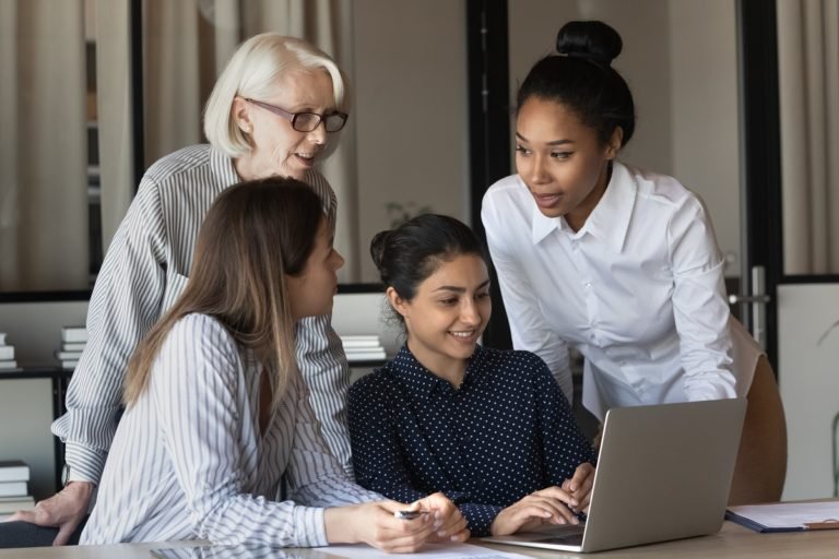 Friendly,Multiracial,Corporate,Female,Team,Collaborate,At,Office,Interacting,Brainstorming